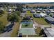 Aerial view of a friendly mobile home community with manicured lawns and ample green space at 10029 Wellington Ave, Dade City, FL 33525