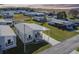 Aerial view showcases the property in a vibrant community with beautiful scenery at 10029 Wellington Ave, Dade City, FL 33525