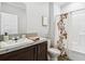 Bathroom featuring a vanity with a sink, mirror and bathtub with shower at 10029 Wellington Ave, Dade City, FL 33525