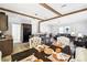 This dining room has rustic ceiling beams and an open floor plan to the Gathering room at 10029 Wellington Ave, Dade City, FL 33525