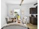 An elegant dining room features a window with a lovely view at 10029 Wellington Ave, Dade City, FL 33525