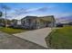 Charming single-Gathering home with a covered parking spot and a well-manicured front yard, perfect for suburban living at 10029 Wellington Ave, Dade City, FL 33525