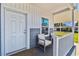 Relaxing front porch with seating area and stylish decor perfect for enjoying the outdoors at 10029 Wellington Ave, Dade City, FL 33525