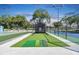 Community golf practice area with netting and putting green at 10029 Wellington Ave, Dade City, FL 33525