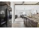 Open kitchen layout with stainless steel appliances and seamless flow to the living area at 10029 Wellington Ave, Dade City, FL 33525