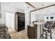 Modern kitchen with sleek countertops, barstool seating and easy access to laundry room at 10029 Wellington Ave, Dade City, FL 33525