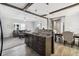 Open-concept living space with stylish furnishings and a seamless flow to the dining and kitchen areas at 10029 Wellington Ave, Dade City, FL 33525