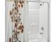 Shower with a curtain and a shower head at 10029 Wellington Ave, Dade City, FL 33525