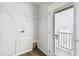 Utility room with access to outside and visible washer hookups at 10029 Wellington Ave, Dade City, FL 33525