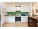 Bright kitchen featuring modern stainless steel appliances and granite countertops at 1008 E 25Th Ave, Tampa, FL 33605