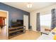 Cozy living room features modern finishes and a mounted television for optimal viewing at 1008 E 25Th Ave, Tampa, FL 33605