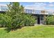 View of the lawn and enclosed patio, providing an outdoor living space for relaxation and entertainment at 10135 Post Harvest Dr, Riverview, FL 33578