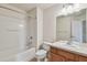 Bathroom with a combined tub and shower, toilet, and single sink vanity at 10135 Post Harvest Dr, Riverview, FL 33578