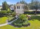 Picturesque community entrance with tower feature, landscaping, and signage at 10135 Post Harvest Dr, Riverview, FL 33578