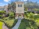 Community entrance tower with stone accents, lush greenery, and clear signage at 10135 Post Harvest Dr, Riverview, FL 33578