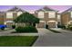 Charming townhome showcasing well-manicured landscaping and a private driveway at 10135 Post Harvest Dr, Riverview, FL 33578