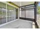A screened-in patio features concrete floors and has access to the unit's interior via a slider at 10135 Post Harvest Dr, Riverview, FL 33578