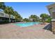 Inviting community pool area with lounge chairs, palm trees, and sunny skies at 10135 Post Harvest Dr, Riverview, FL 33578