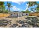 Large backyard with ample space and a wooden fence, perfect for outdoor activities and privacy at 10218 Lola St, Tampa, FL 33612