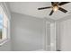 Bedroom with closet, window, and access to bathroom featuring white marble floor tiles at 10218 Lola St, Tampa, FL 33612