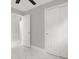 Bedroom featuring a closet with sliding doors, an open door, and marble floor tiles at 10218 Lola St, Tampa, FL 33612