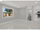 Bedroom featuring a window, recessed lighting, and access to the bathroom and kitchen at 10218 Lola St, Tampa, FL 33612