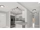 Bright open concept kitchen featuring granite counters and stainless appliances at 10218 Lola St, Tampa, FL 33612