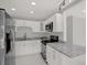Well-equipped kitchen with stainless steel appliances and granite countertops at 10218 Lola St, Tampa, FL 33612
