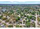 Scenic aerial perspective capturing a tranquil neighborhood with tree-lined streets and cozy residential homes at 10218 Lola St, Tampa, FL 33612