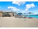 Relaxing poolside bar and lounge area with plenty of seating and shade umbrellas near the blue lagoon at 11443 Cay Spruce Way, San Antonio, FL 33576