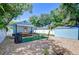 Backyard with a shed, privacy fence, and outdoor seating at 1240 Georgia Ave, Dunedin, FL 34698