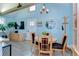 Bright dining area featuring modern decor, hardwood floors, and stylish furnishings at 1240 Georgia Ave, Dunedin, FL 34698