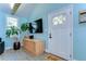 Bright entryway featuring modern decor, stylish console, and a welcoming 'hello' doormat at 1240 Georgia Ave, Dunedin, FL 34698