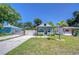 Charming blue cottage with a well-manicured front yard and inviting curb appeal at 1240 Georgia Ave, Dunedin, FL 34698