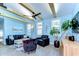 Comfortable living room featuring vaulted ceilings, wood beams, stylish furnishings, and a ceiling fan at 1240 Georgia Ave, Dunedin, FL 34698