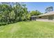 This home features a spacious backyard with a screened in pool at 12801 Castlemaine Dr, Tampa, FL 33626