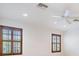 Bedroom with white walls, plantation shutters, recessed lighting, and a ceiling fan at 12801 Castlemaine Dr, Tampa, FL 33626