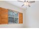 Bedroom showcasing ceiling fan, bright natural light and a view to the outdoors at 12801 Castlemaine Dr, Tampa, FL 33626