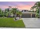 Beautiful single Gathering home with well-manicured lawn and three-car garage at 12801 Castlemaine Dr, Tampa, FL 33626