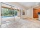 The living room offers sliding glass doors that provide access to a backyard pool at 12801 Castlemaine Dr, Tampa, FL 33626