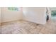Cozy room showcasing tile floors, a window with natural light, and neutral-colored walls at 12801 Castlemaine Dr, Tampa, FL 33626
