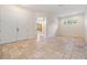 An entry to the living room includes a front door, tile floors, neutral walls, and plenty of natural light at 12801 Castlemaine Dr, Tampa, FL 33626