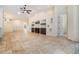 A large living room offers neutral walls, high ceilings, and custom built-in shelving units at 12801 Castlemaine Dr, Tampa, FL 33626
