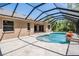 The backyard is perfect for entertaining with a screened in pool and outdoor area at 12801 Castlemaine Dr, Tampa, FL 33626