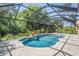 This screened pool features a water feature and a spa for the ultimate outdoor living experience at 12801 Castlemaine Dr, Tampa, FL 33626