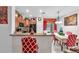 Eat in kitchen featuring dark appliances, breakfast bar, and adjacent dining area at 12913 Dream Catcher Way, Riverview, FL 33579