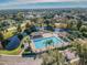 A community pool and gazebo, near a pond with a fountain and picnic tables, offer outdoor relaxation at 12913 Dream Catcher Way, Riverview, FL 33579