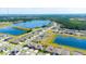 Scenic aerial view of the community, showcasing the serene lake and well-planned neighborhood layout at 13246 Twin Bridges Dr, Riverview, FL 33579