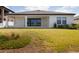 Lush backyard with covered patio and well-manicured lawn perfect for outdoor enjoyment at 13246 Twin Bridges Dr, Riverview, FL 33579