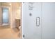 This bathroom features a glass door shower and tile floors at 13246 Twin Bridges Dr, Riverview, FL 33579